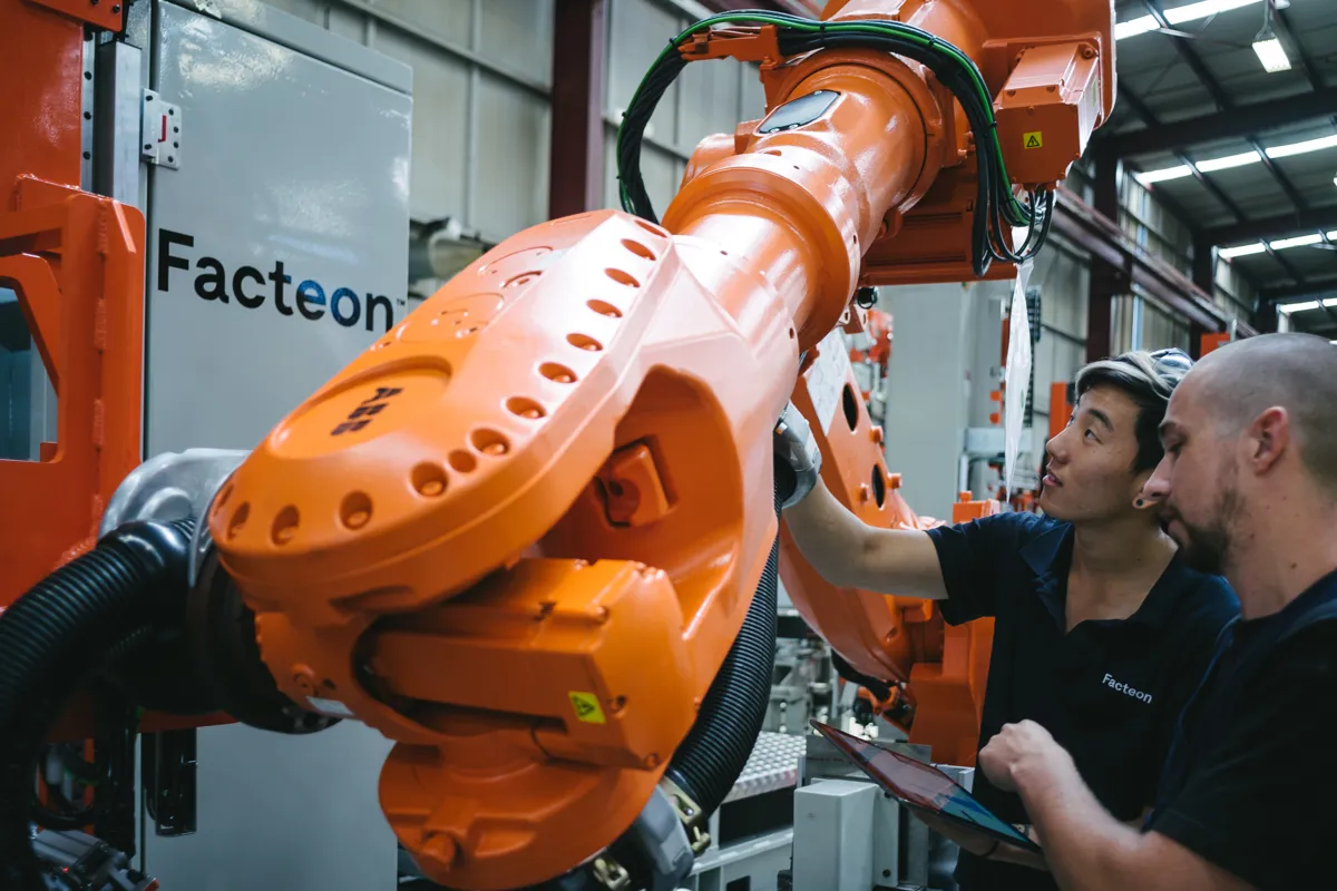 A Facteon engineer at work on production machinery in the Auckland workshop