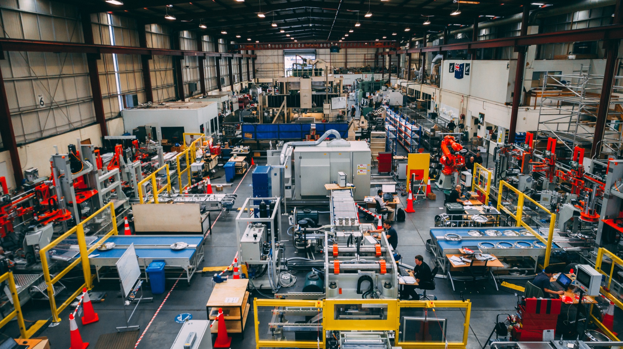 Facteon's Auckland plant floor, with production cells mid-build and engineers working alongside them